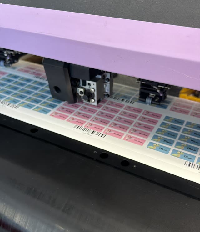 Personalized name sticker sheets being printed